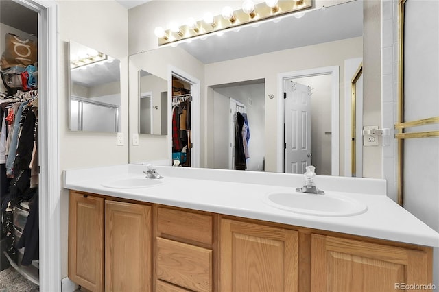 12585 S Beaver Creek Way, Parker, CO 80134 - full bath featuring a walk in closet, double vanity, and a shower with shower door