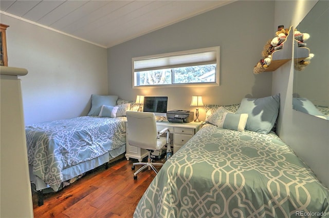 bedroom with vaulted ceiling, wood ceiling, dark wood-style floors, and ornamental molding