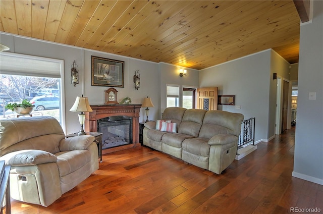 611 W 12th St, Glenwood Springs, CO 81601 - living room with wooden ceiling, wood finished floors, ornamental molding, and a glass covered fireplace