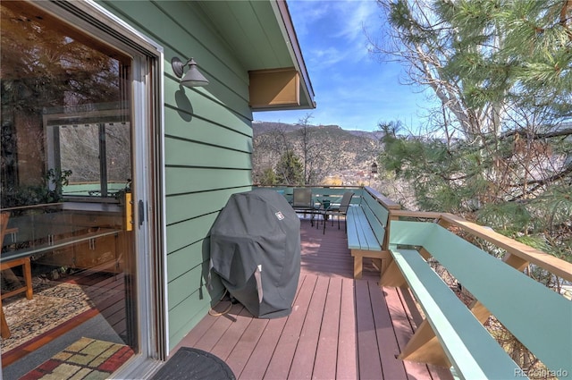611 W 12th St, Glenwood Springs, CO 81601 - wooden terrace with a mountain view, outdoor dining area, and area for grilling