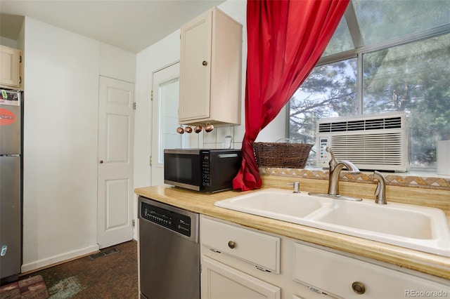 kitchen featuring cooling unit, stainless steel appliances, and sink