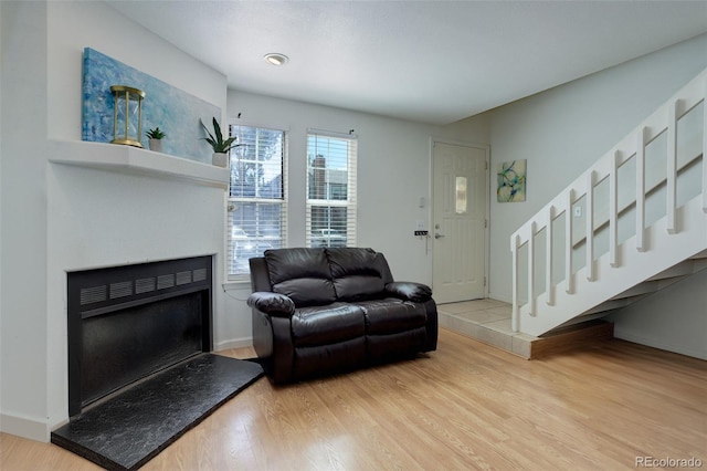 living room with light hardwood / wood-style flooring