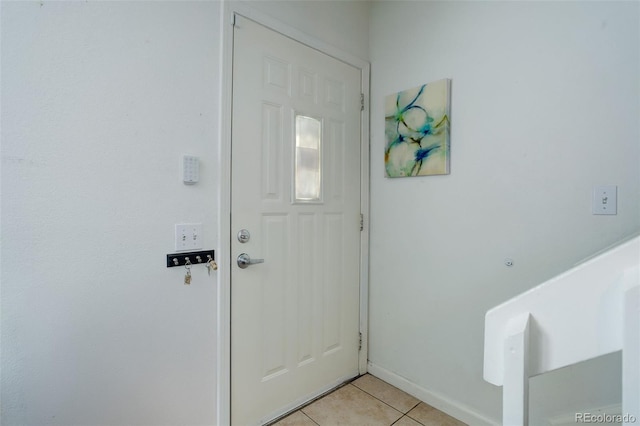 doorway to outside featuring light tile patterned floors