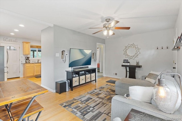2967 Olive St, Denver, CO 80207 - living room featuring ceiling fan, light wood-style flooring, recessed lighting, and baseboards
