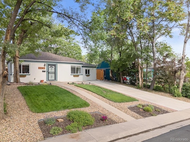 2967 Olive St, Denver, CO 80207 - view of front facade with driveway, stucco siding, a front yard, and roof with shingles