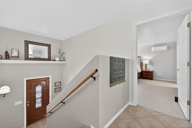 20854 State Highway 96, Wetmore, CO 81253 - entryway with a wall unit AC, light tile patterned floors, and light carpet