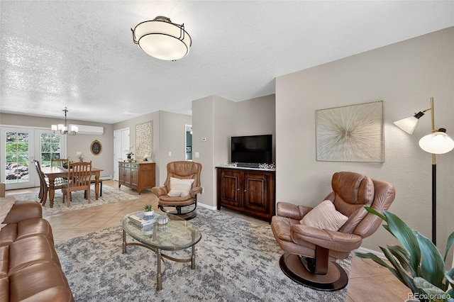 20854 State Highway 96, Wetmore, CO 81253 - living room featuring a chandelier, a wall mounted air conditioner, a textured ceiling, light tile patterned floors, and baseboard heating