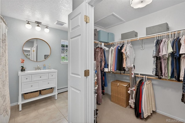 20854 State Highway 96, Wetmore, CO 81253 - spacious closet with attic access, baseboard heating, and light tile patterned floors