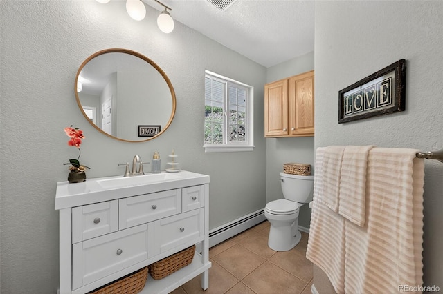 20854 State Highway 96, Wetmore, CO 81253 - bathroom featuring baseboard heating, vanity, tile patterned flooring, and a textured ceiling