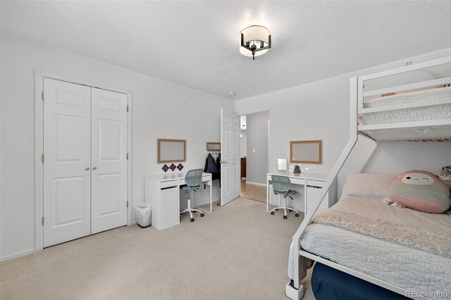 20854 State Highway 96, Wetmore, CO 81253 - bedroom featuring an office area, light carpet, and a textured ceiling