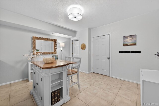20854 State Highway 96, Wetmore, CO 81253 - dining room with a textured ceiling and light tile patterned floors