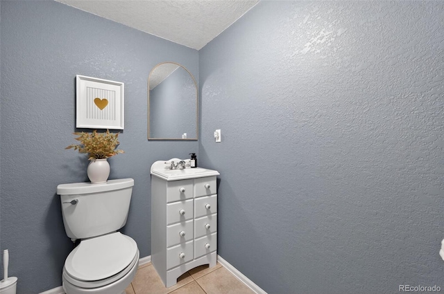 20854 State Highway 96, Wetmore, CO 81253 - half bathroom with vanity, tile patterned floors, and a textured ceiling