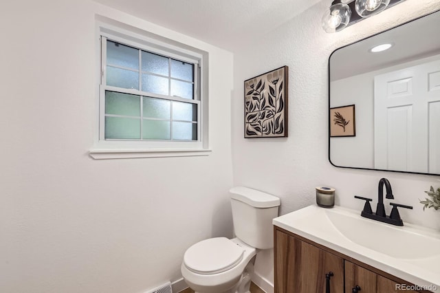 3374 S Niagara Way, Denver, CO 80224 - half bathroom featuring vanity and toilet