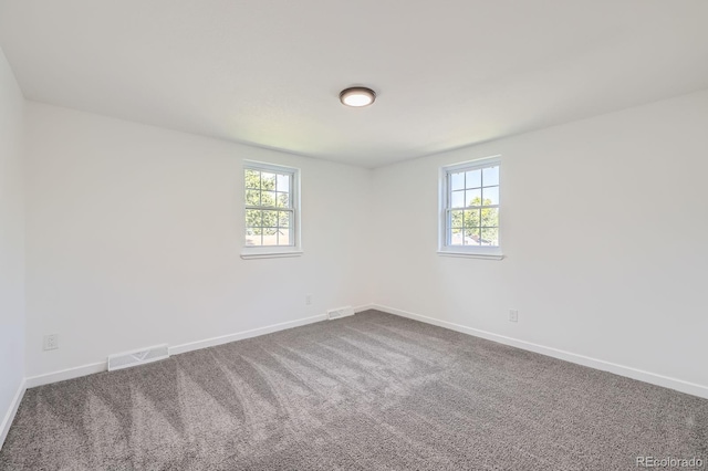 3374 S Niagara Way, Denver, CO 80224 - empty room with baseboards and dark colored carpet