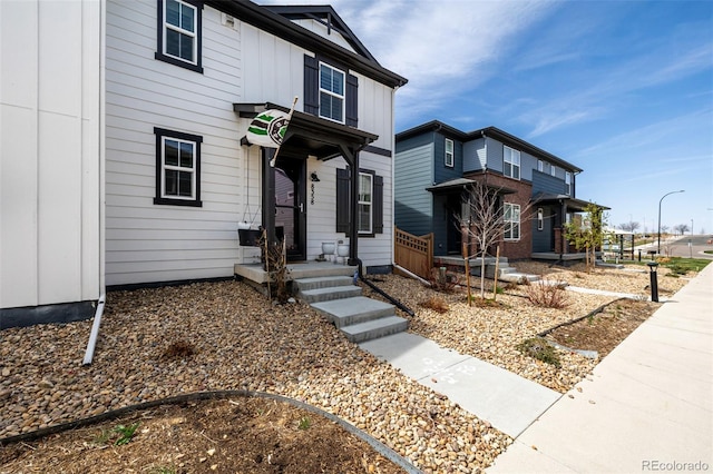 8358 Howell St Unit B, Arvada, CO 80005 - view of front of home with board and batten siding