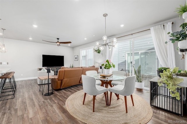 8358 Howell St Unit B, Arvada, CO 80005 - dining space with a chandelier, wood finished floors, recessed lighting, and a ceiling fan