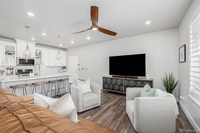 8358 Howell St Unit B, Arvada, CO 80005 - living area featuring dark wood finished floors, recessed lighting, and a ceiling fan