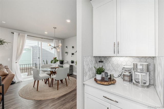 8358 Howell St Unit B, Arvada, CO 80005 - dining area featuring wood finished floors, a chandelier, and recessed lighting