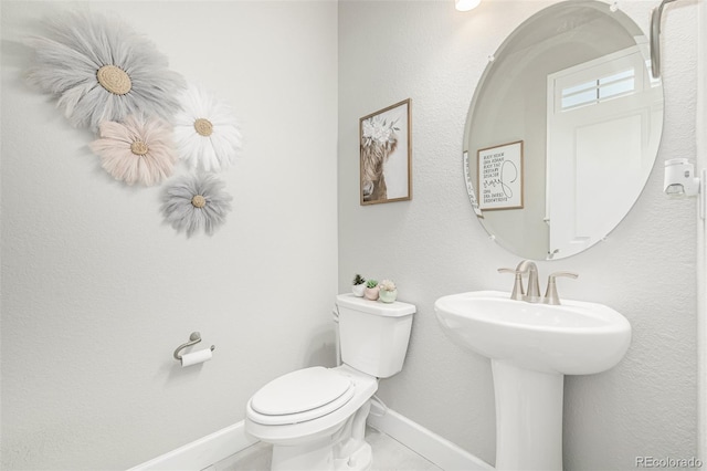 8358 Howell St Unit B, Arvada, CO 80005 - half bath featuring baseboards and toilet
