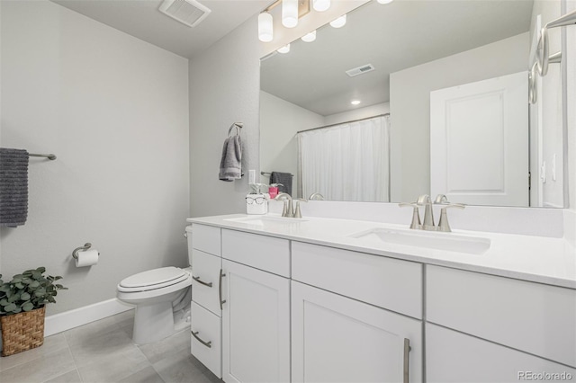 8358 Howell St Unit B, Arvada, CO 80005 - bathroom featuring double vanity, tile patterned flooring, and a shower with shower curtain