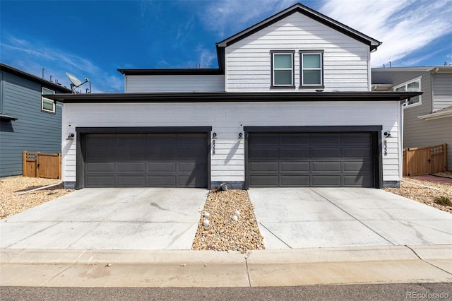 8358 Howell St Unit B, Arvada, CO 80005 - view of front of home featuring concrete driveway and an attached garage