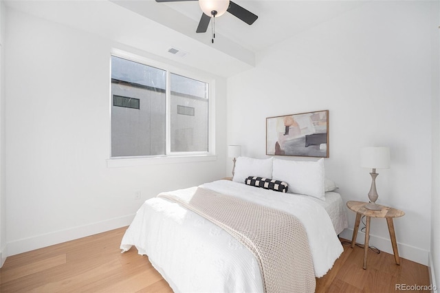 bedroom featuring wood-type flooring and ceiling fan