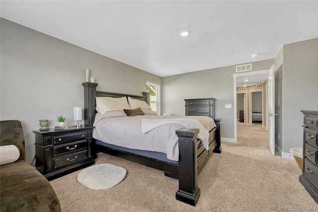 bedroom featuring light carpet