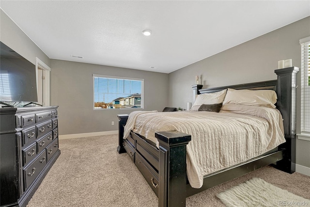 bedroom featuring light carpet