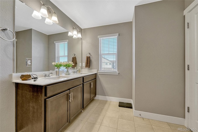 bathroom with tile patterned flooring and vanity