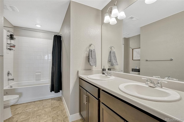 full bathroom with vanity, toilet, and shower / bath combo