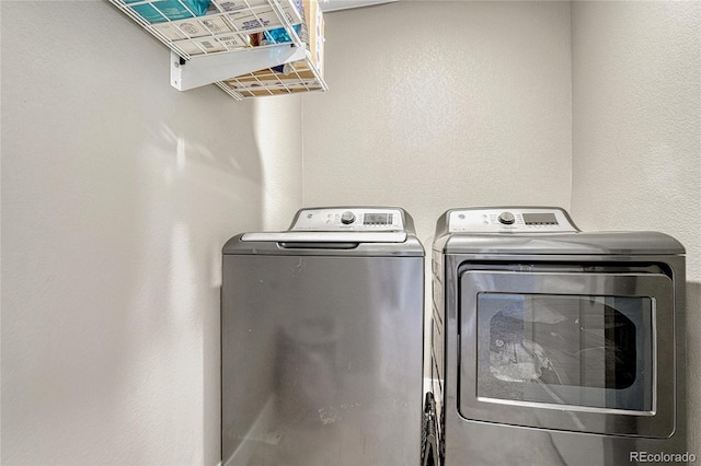 washroom with washing machine and dryer