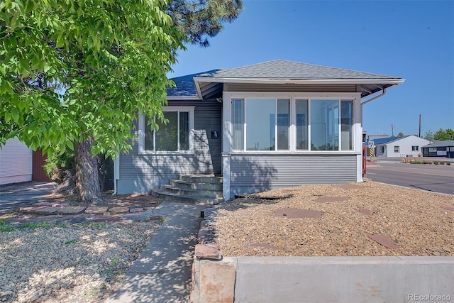 5723 Zephyr St, Arvada, CO 80002 - bungalow with roof with shingles and a sunroom