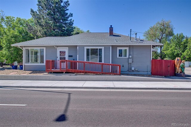 5723 Zephyr St, Arvada, CO 80002 - view of front of house with a chimney and roof with shingles