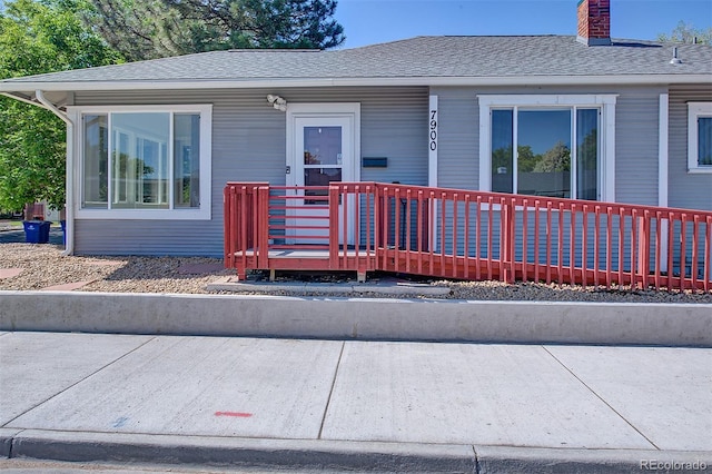 5723 Zephyr St, Arvada, CO 80002 - view of front of property with a chimney and a shingled roof