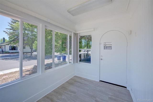 5723 Zephyr St, Arvada, CO 80002 - unfurnished sunroom with baseboards