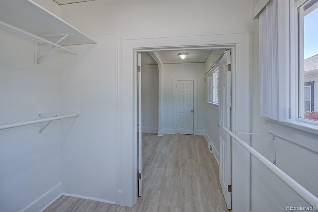5723 Zephyr St, Arvada, CO 80002 - walk in closet with light wood finished floors