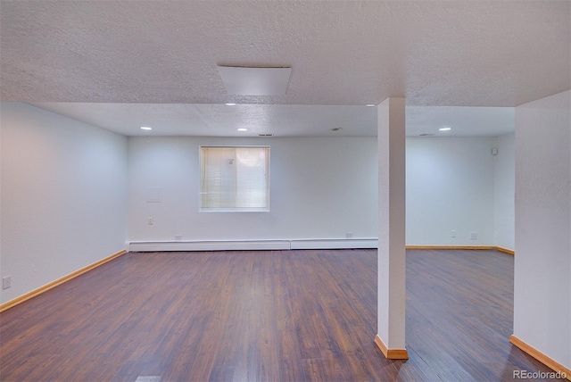 5723 Zephyr St, Arvada, CO 80002 - below grade area featuring baseboards, a textured ceiling, wood finished floors, a baseboard heating unit, and recessed lighting