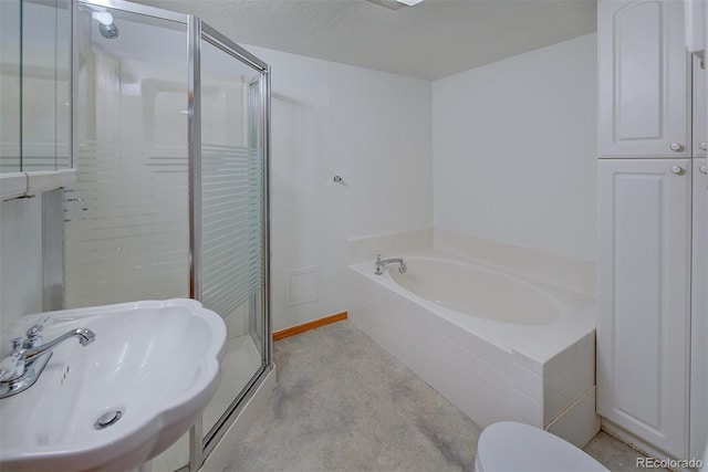 5723 Zephyr St, Arvada, CO 80002 - bathroom with a shower stall, a garden tub, a sink, and toilet