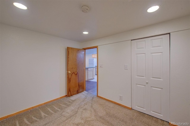 5723 Zephyr St, Arvada, CO 80002 - unfurnished bedroom featuring carpet flooring, baseboards, recessed lighting, and a closet