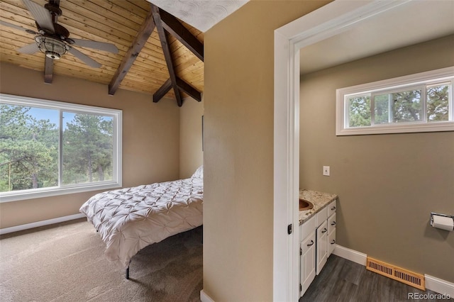 bedroom featuring wood ceiling and baseboards