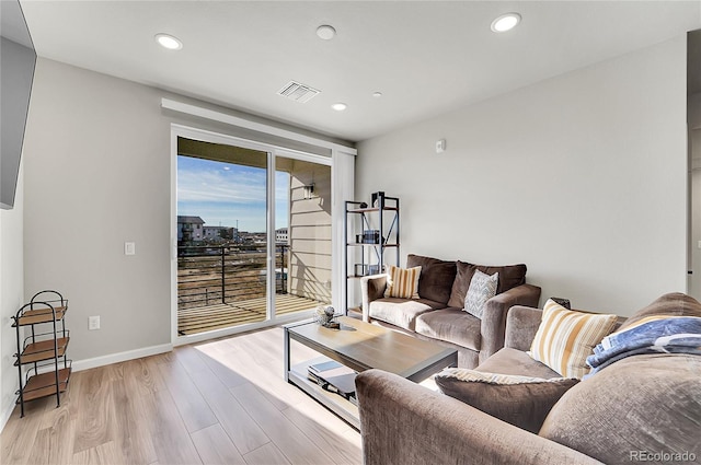 living room with light hardwood / wood-style floors