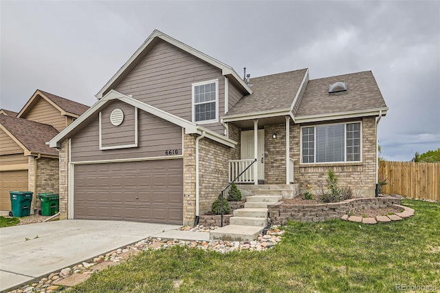 view of front of property featuring fence, driveway, a garage, a front yard, and a shingled roof