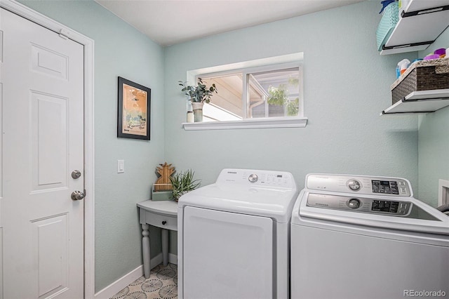 6039 S Ukraine Cir, Aurora, CO 80015 - washroom featuring washing machine and clothes dryer and baseboards