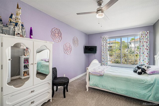 6039 S Ukraine Cir, Aurora, CO 80015 - bedroom featuring carpet floors, baseboards, a textured ceiling, and a ceiling fan