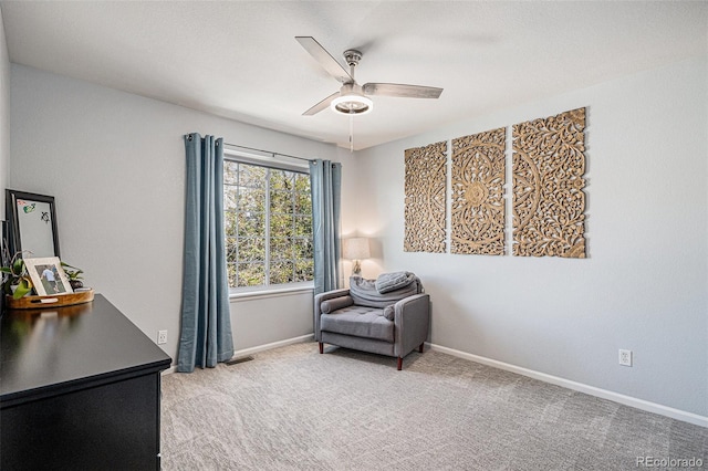 6039 S Ukraine Cir, Aurora, CO 80015 - living area featuring a ceiling fan, carpet, and baseboards