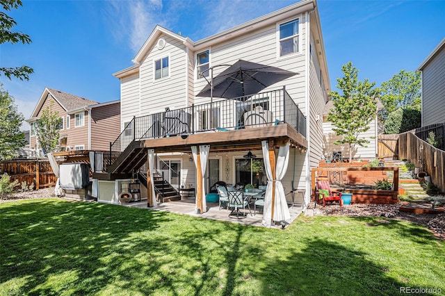 6039 S Ukraine Cir, Aurora, CO 80015 - rear view of property with a vegetable garden, stairway, a wooden deck, and a patio area