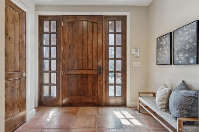 foyer entrance with baseboards