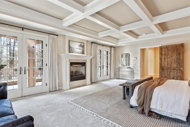 bedroom with coffered ceiling, access to exterior, carpet flooring, french doors, and beam ceiling