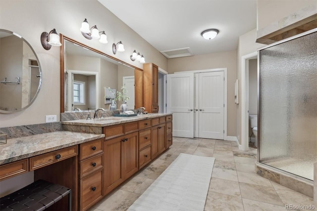 full bath with toilet, a shower stall, vanity, and tile patterned floors