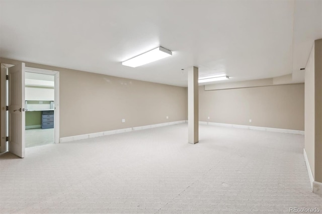 finished basement featuring carpet flooring and baseboards